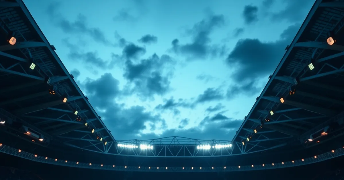Dunkles, stimmungsvolles Stadionbild bei Flutlicht mit mehreren Bildschirmen im Vordergrund, die ein Frauenfußballspiel zeigen